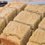 squares of gluten free cornbread on a cutting board