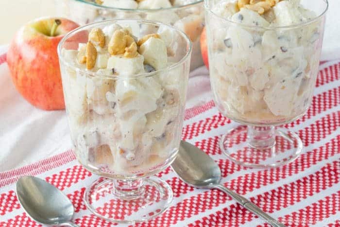 Mini glass parfait dishes with Candy Bar Apple Salad with chocolate and peanuts