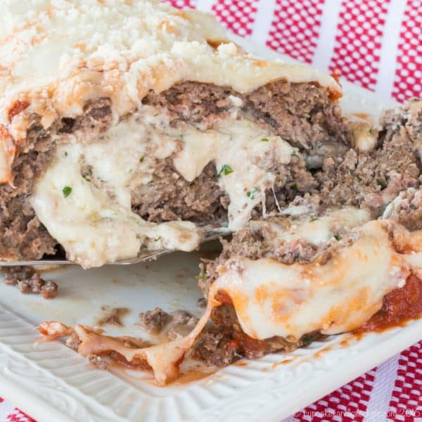 A meatloaf sliced open to show the cheesy stuffing.