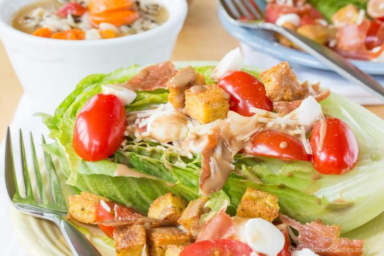 Wedge salad made with Romaine hearts and Italian ingredients