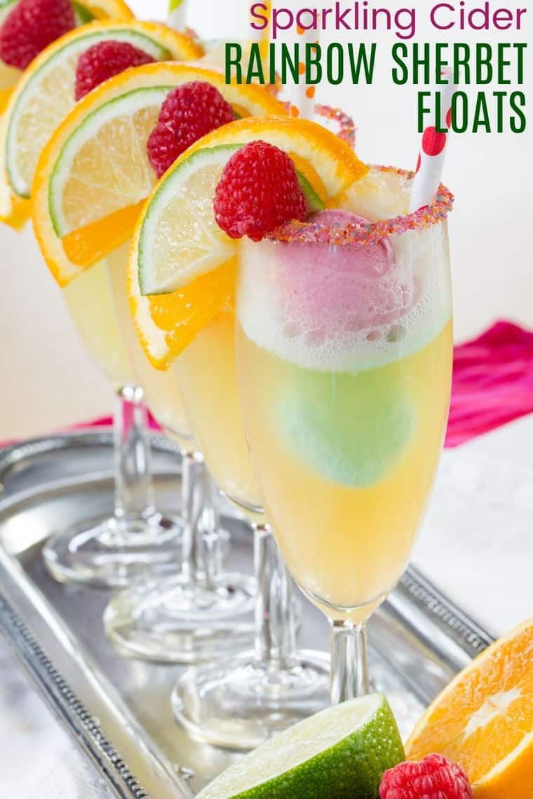 Four Champagne Glasses Filled with Sparkling Apple Cider and Scoops of Rainbow Sherbet