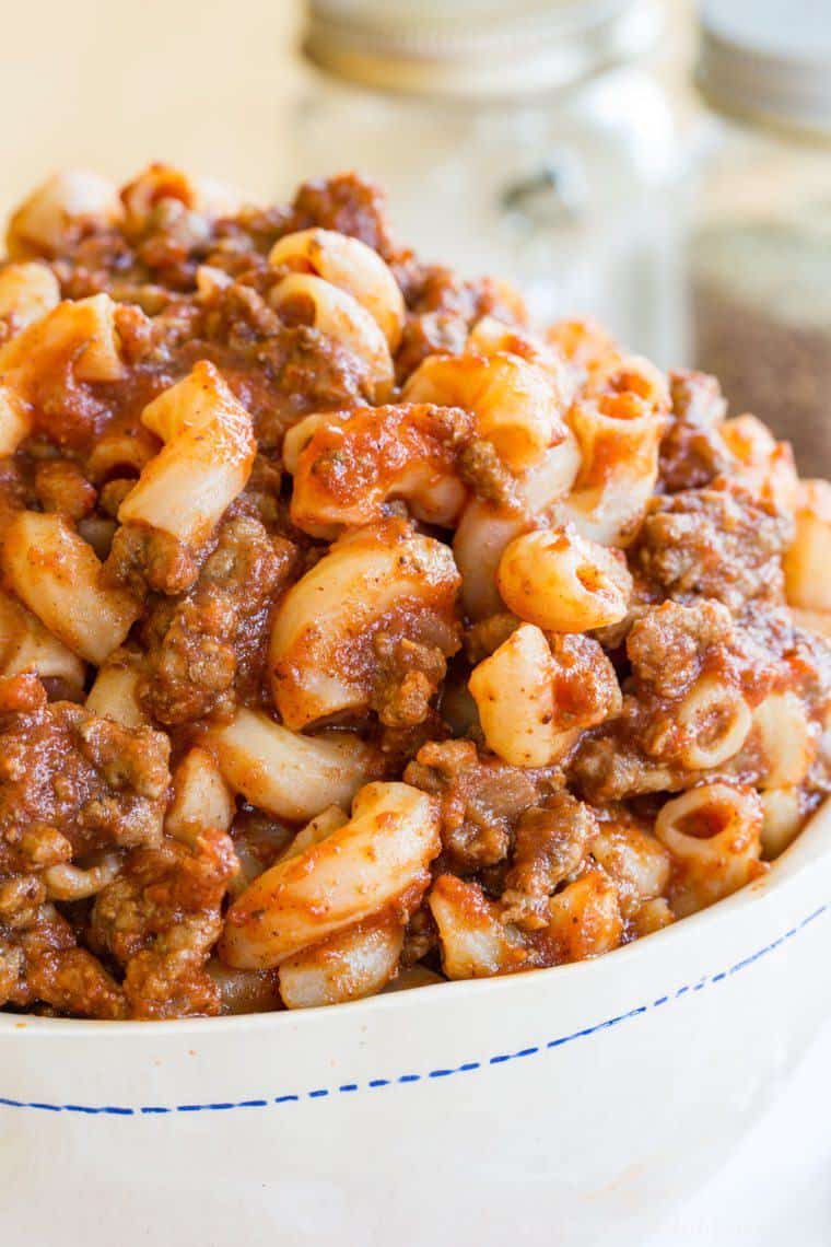 Closeup of ground beef and elbow macaroni with sauce in this beeferoni recipe