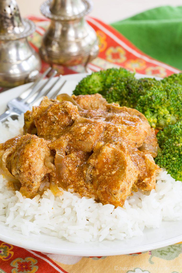 plate of healthy slow cooker butter chicken over rice