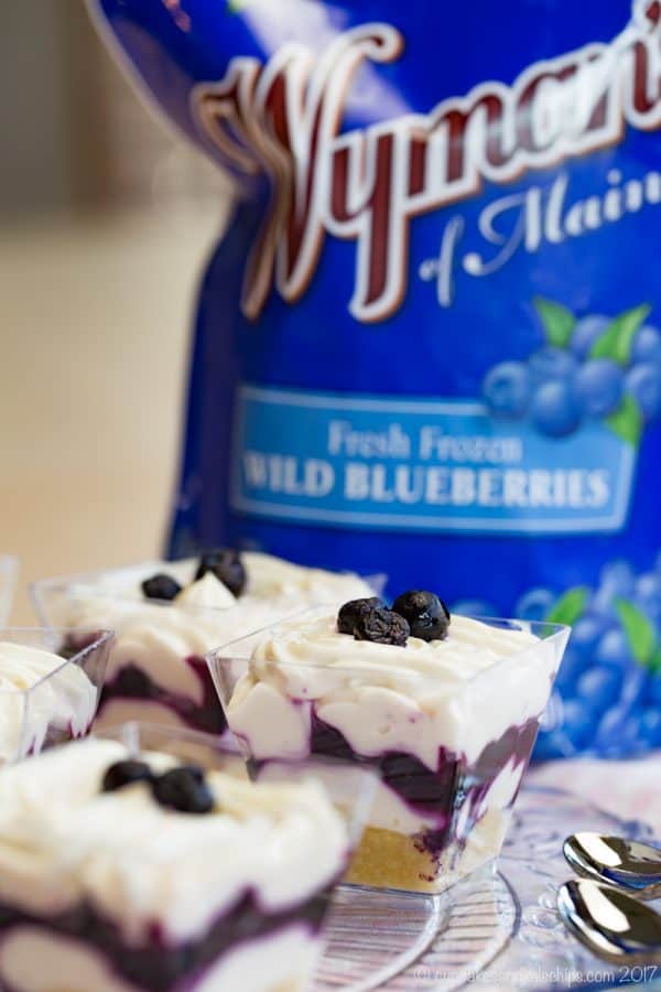 Blueberry Maple Mini Cheesecake Parfaits - an easy no-bake dessert recipe perfect for parties with a gluten free almond meal crust and @WymansofMaine frozen wild blueberries. #AD
