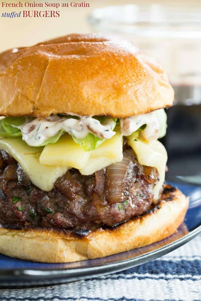 French Onion Soup au Gratin Stuffed Burgers - beef hamburgers stuffed with caramelized onions and topped with more onions, cheese, and a French onion spread. An epic burger recipe to grill this summer!
