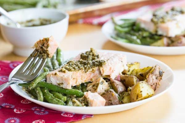 Pesto Salmon Sheet Pan Dinner with Potatoes and Green Beans - an easy dinner recipe that's ready in less than forty minutes with only one pan to clean up. This seafood sheet pan meal made with @GortonsSeafood is a healthy and gluten free addition to your weekly meal plan. #AD