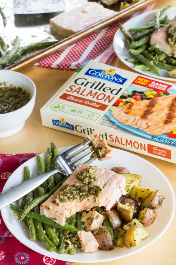 Pesto Salmon Sheet Pan Dinner with Potatoes and Green Beans - an easy dinner recipe that's ready in less than forty minutes with only one pan to clean up. This seafood sheet pan meal made with @GortonsSeafood is a healthy and gluten free addition to your weekly meal plan. #AD