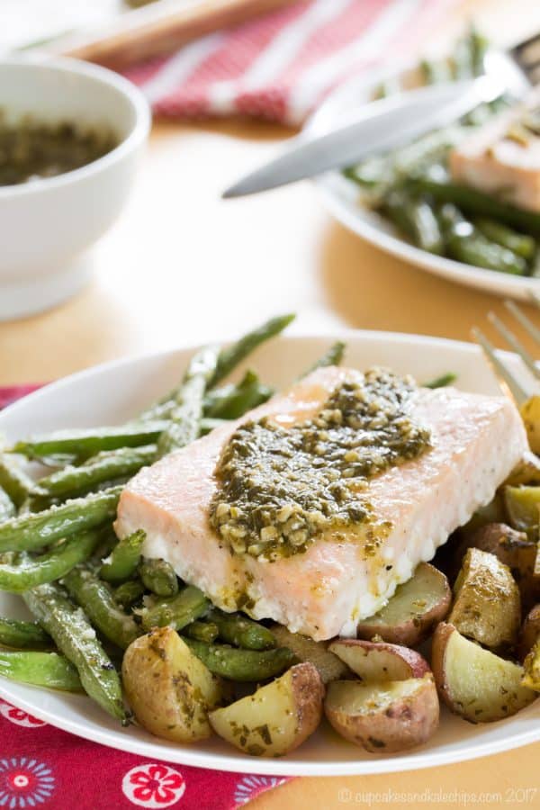 Pesto Salmon Sheet Pan Dinner with Potatoes and Green Beans - an easy dinner recipe that's ready in less than forty minutes with only one pan to clean up. This seafood sheet pan meal made with @GortonsSeafood is a healthy and gluten free addition to your weekly meal plan. #AD