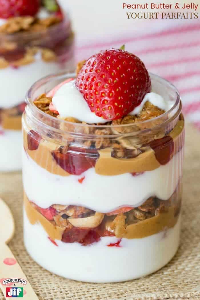 Peanut Butter and Jelly Yogurt Parfaits - a fun recipe to enjoy peanut butter and jelly for breakfast or an after school snack, with layers of Greek yogurt, strawberries, Jif peanut butter, Smucker's jelly, and PB&J granola for some #PBJlove. #ad