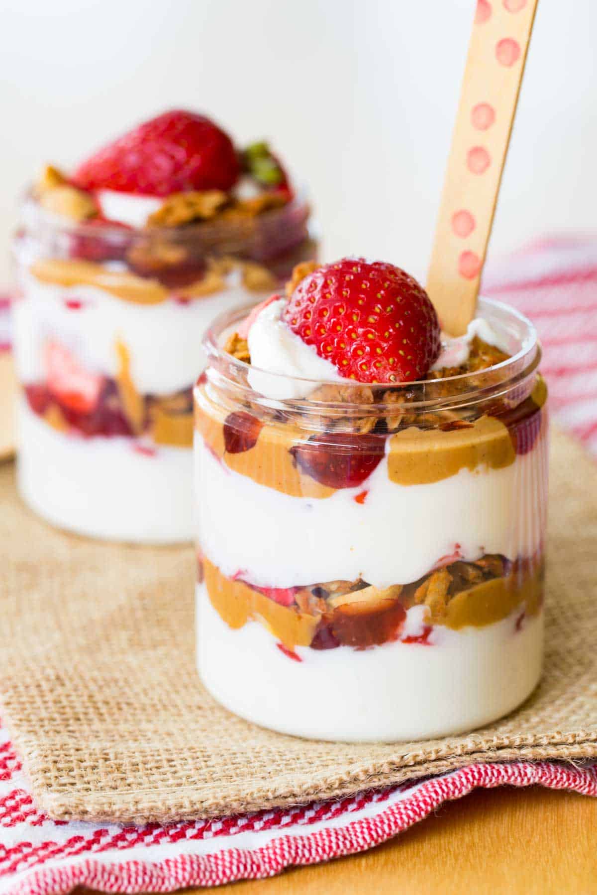 peanut butter and jelly yogurt parfaits in jars