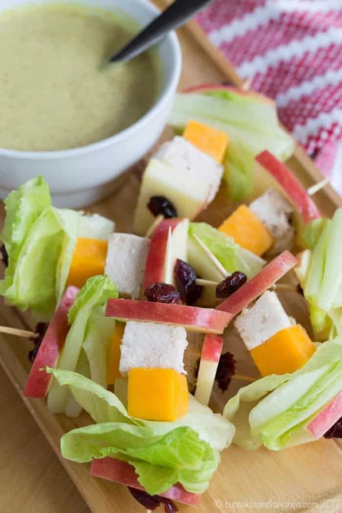 Apple Cheddar Chicken Salad on a Stick with Honey Mustard Dip on a platter