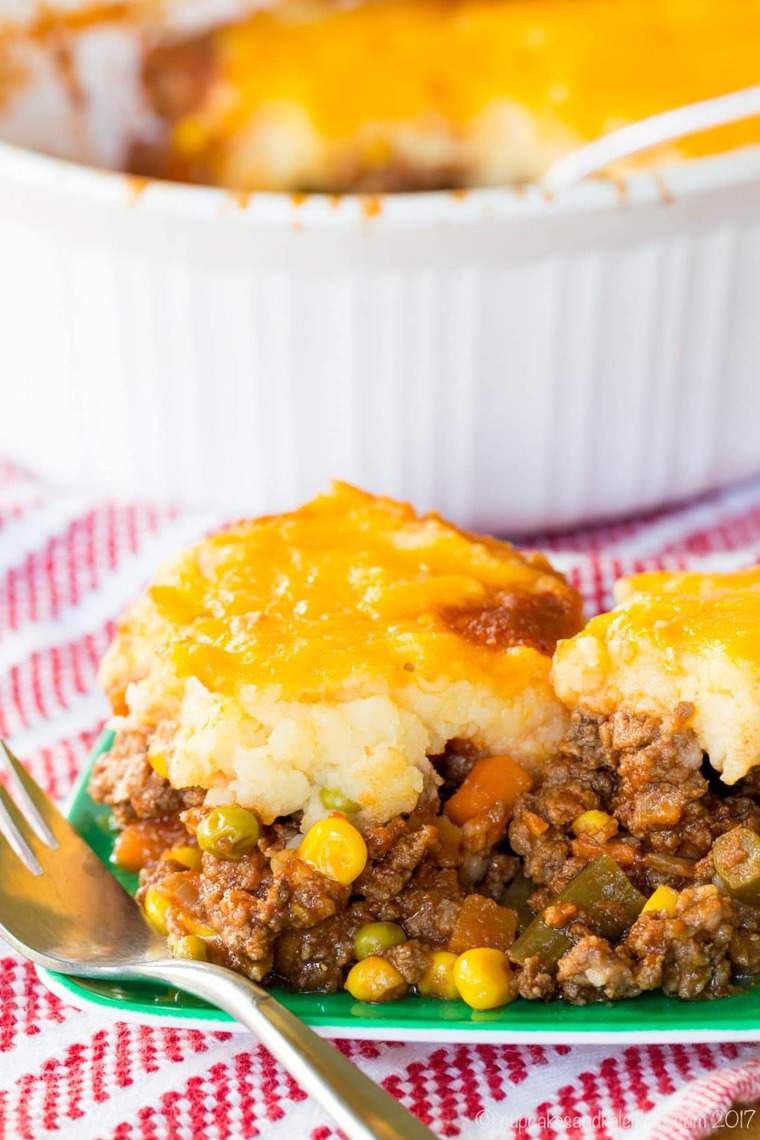 A scoop of Shepherds Pie on a green plate