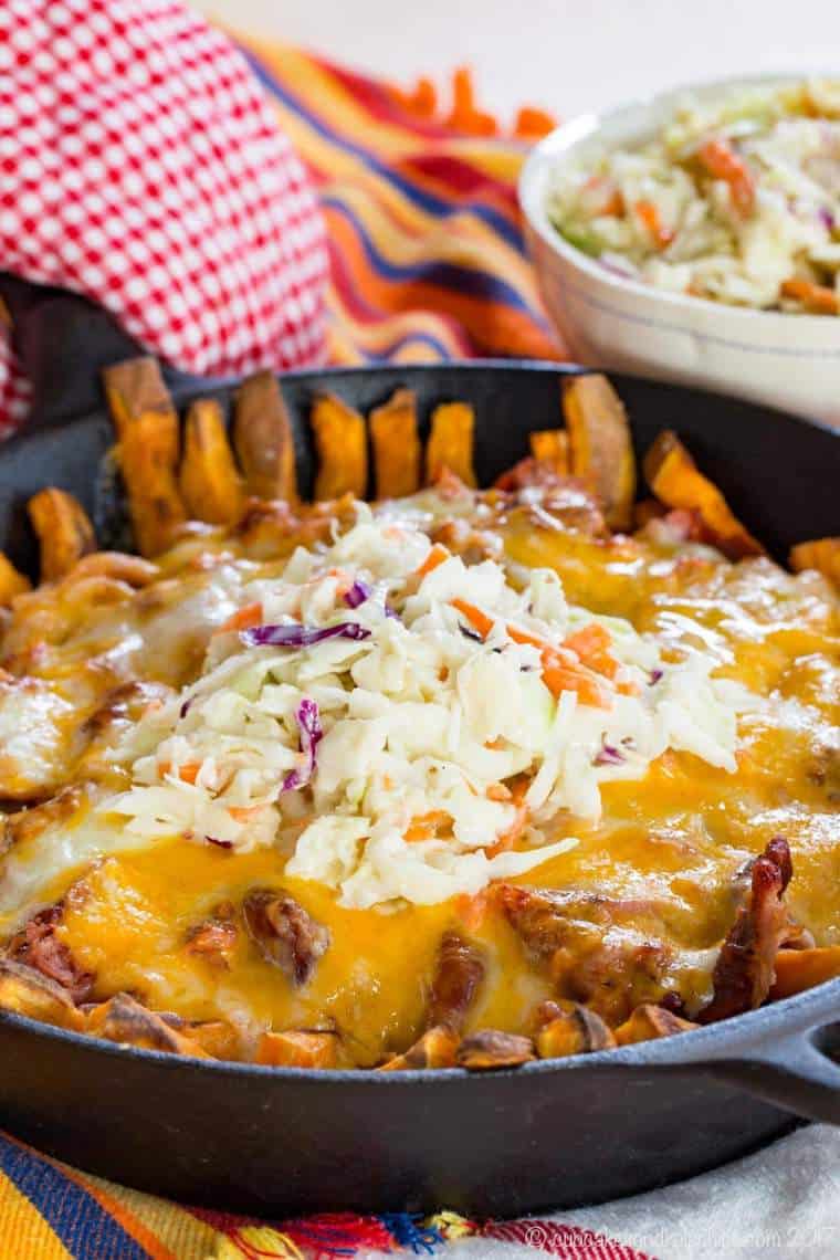 BBQ Pulled Pork Loaded Sweet Potato Fries in a cast iron skillet.