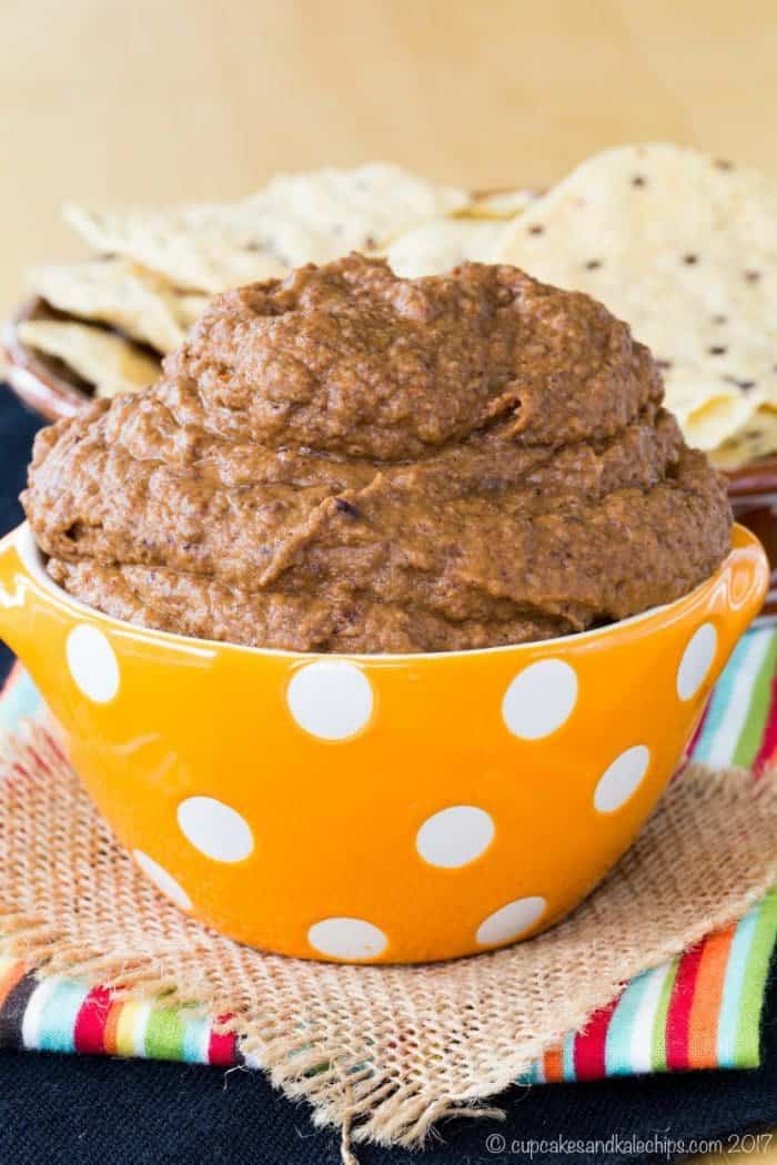 Smoky Cumin Lime Pumpkin Black Bean Hummus in an orange polka dot bowl