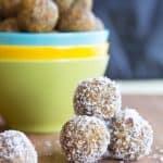 Coconut Apricot Energy Balls in a stack coated with shredded coconut