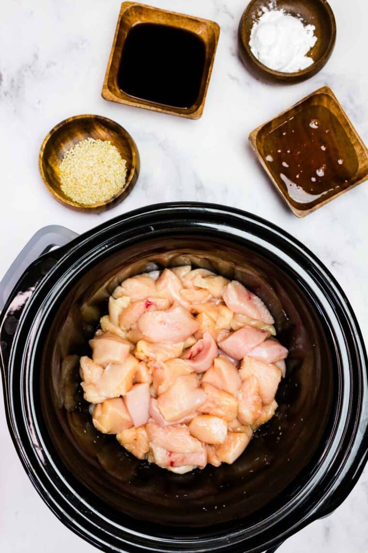 Chunks of chicken in a slow cooker