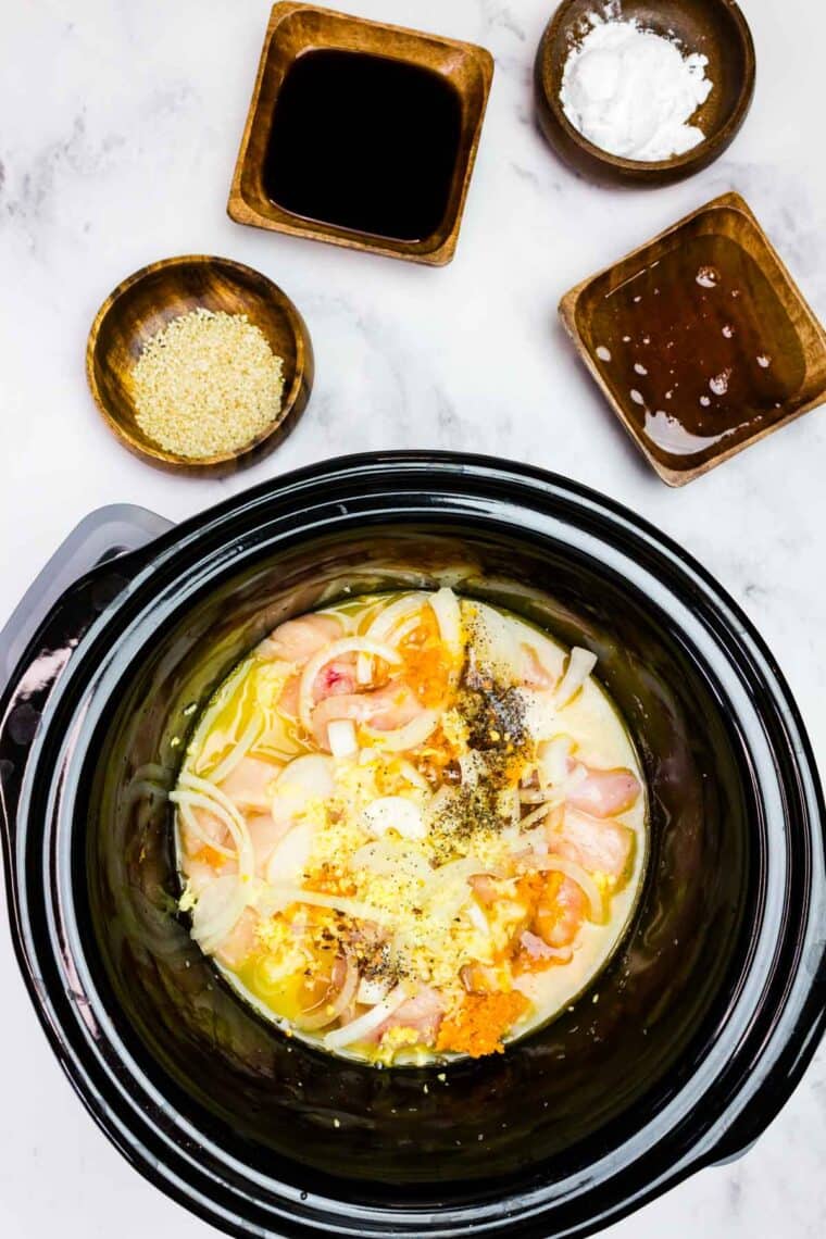 Aromatics and orange zest added to the chicken