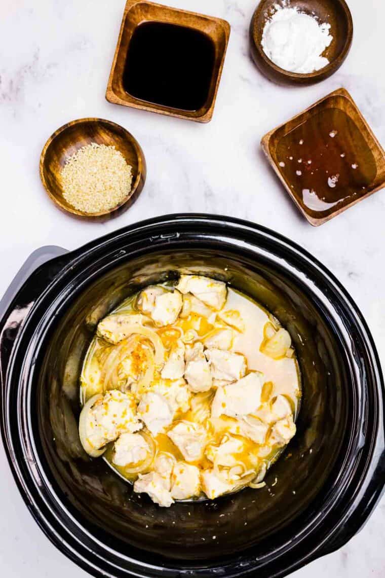 Cooked cubes of chicken in a crockpot