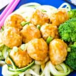 Asian Chicken Meatballs served over zoodles and steamed broccoli.