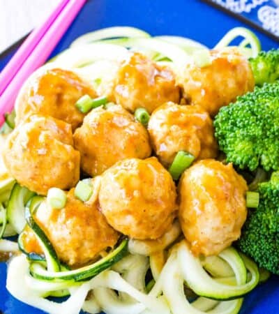 Asian Chicken Meatballs served over zoodles and steamed broccoli.