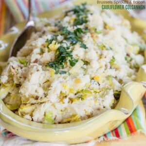 Cauliflower colcannon in a serving bowl with a metal spoon.