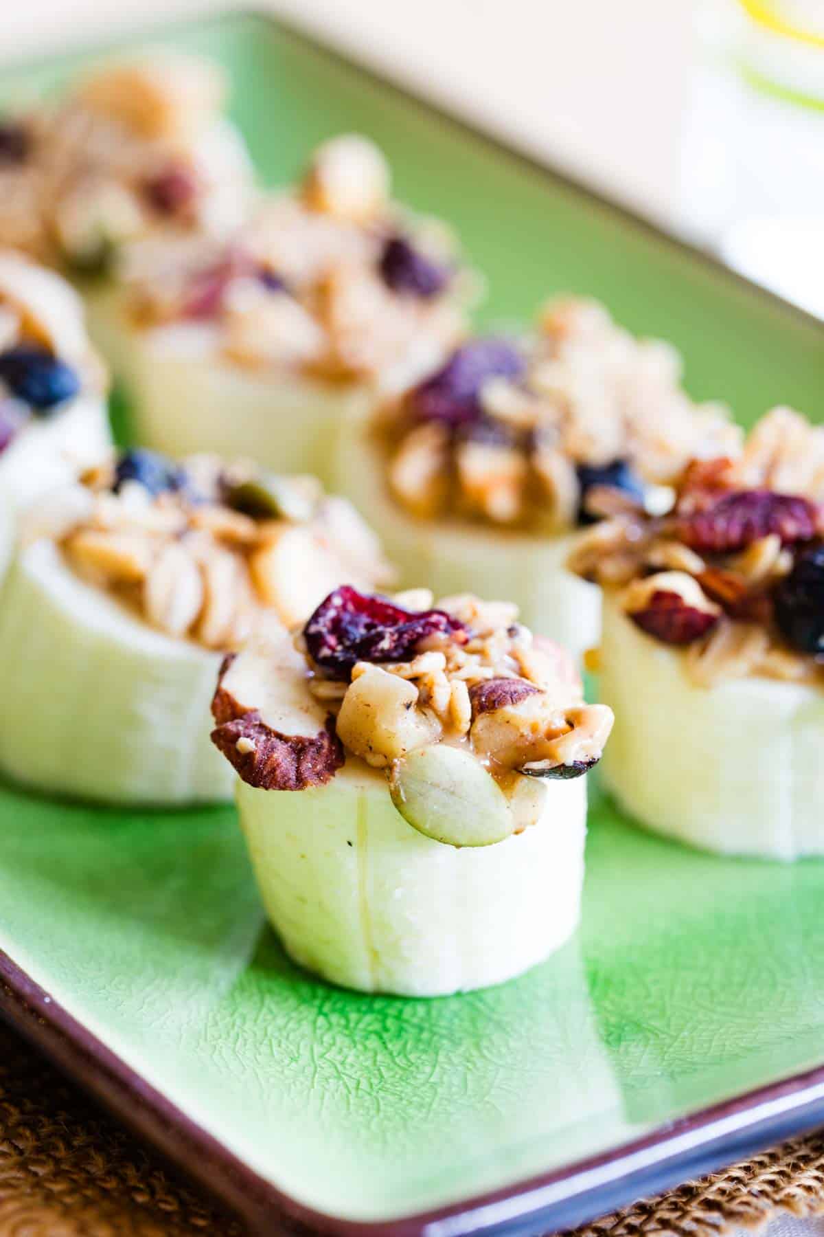 Banana Snack topped with peanut butter and gluten free granola for a vegan option