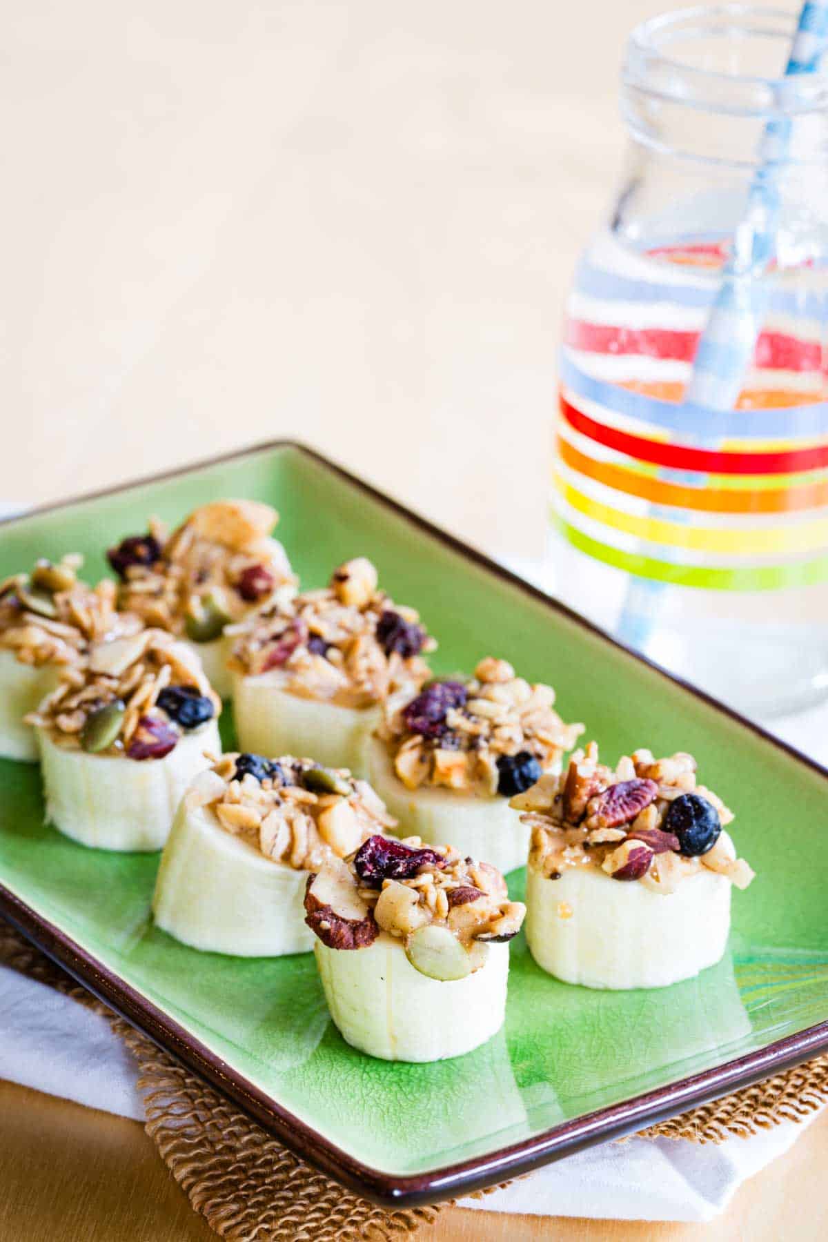 A green rectangular plate with Easy Three-Ingredient Banana Snacks