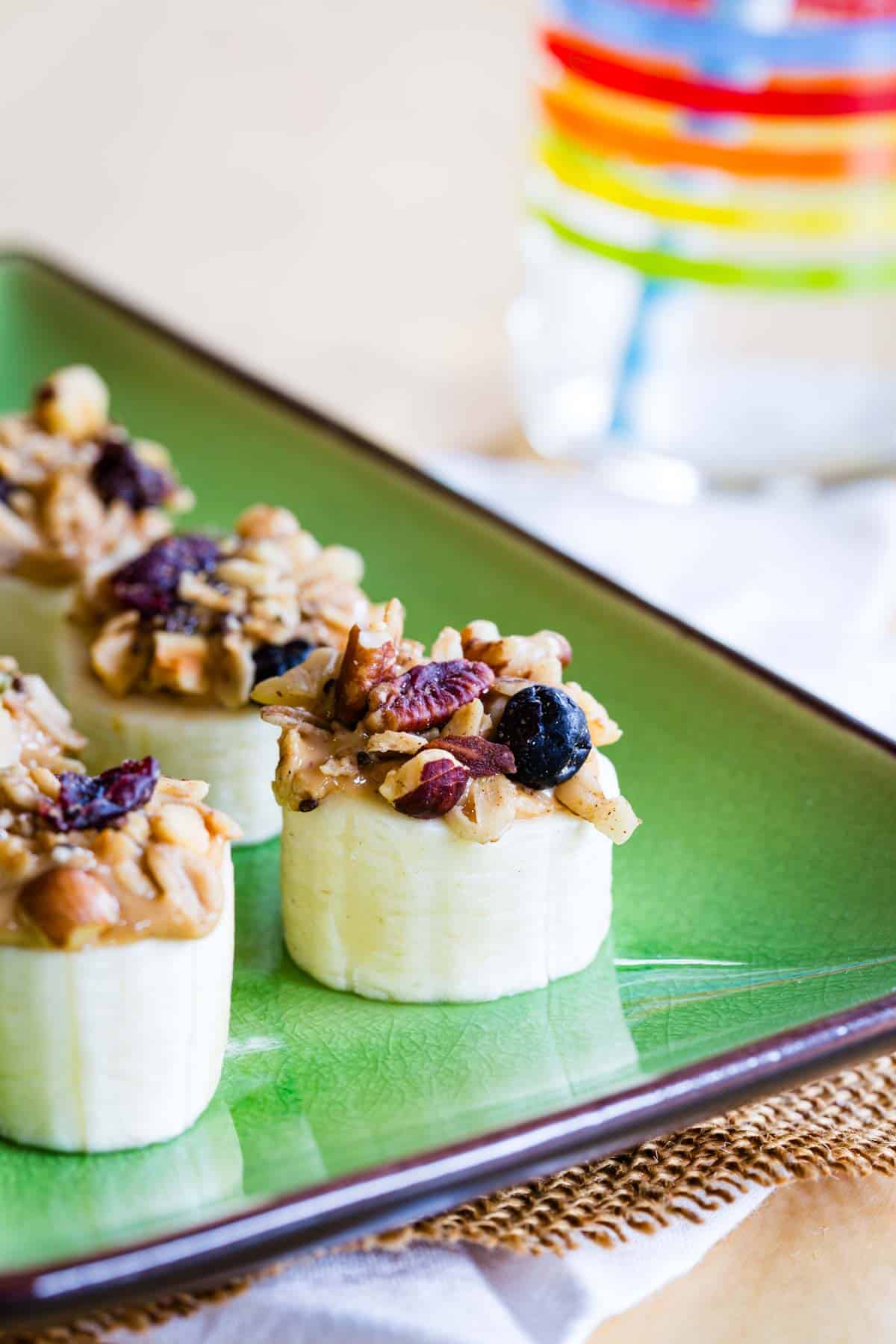 Closeup of one of these Healthy Peanut Butter Banana Snacks topped with granola