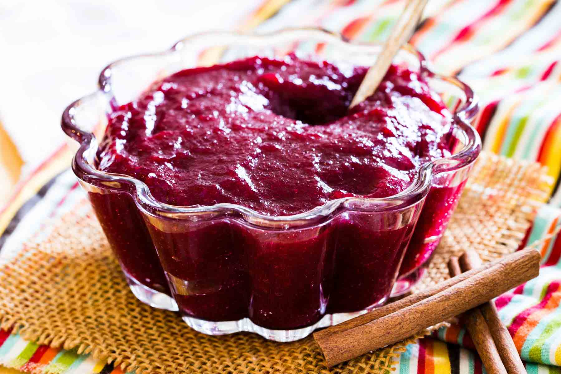 A glass bowl of Cinnamon Orange Cranberry Sauce