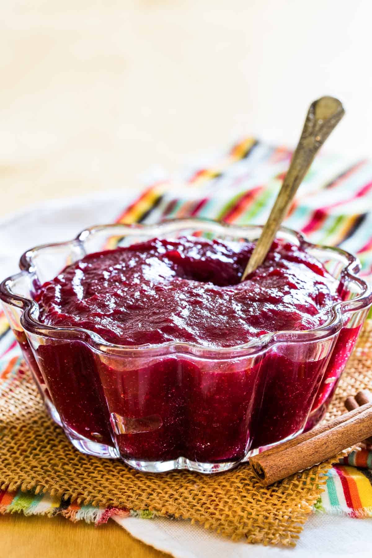 Cinnamon Orange Cranberry Sauce in a glass fluted bowl