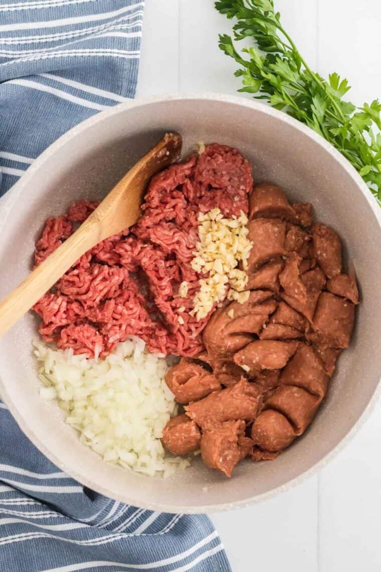 Ground beef, sausage and onion in a pot