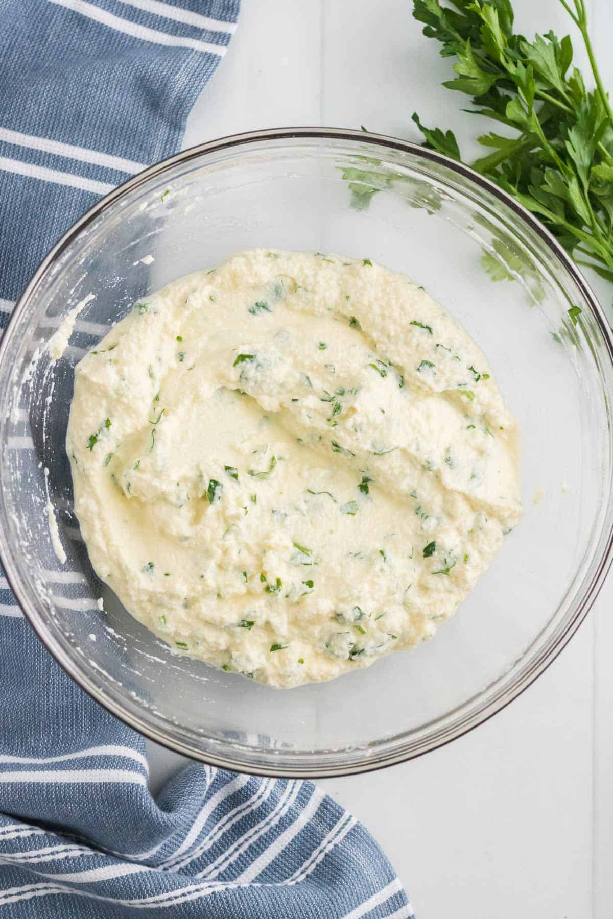 Ricotta mixture for lasagna in a glass bowl