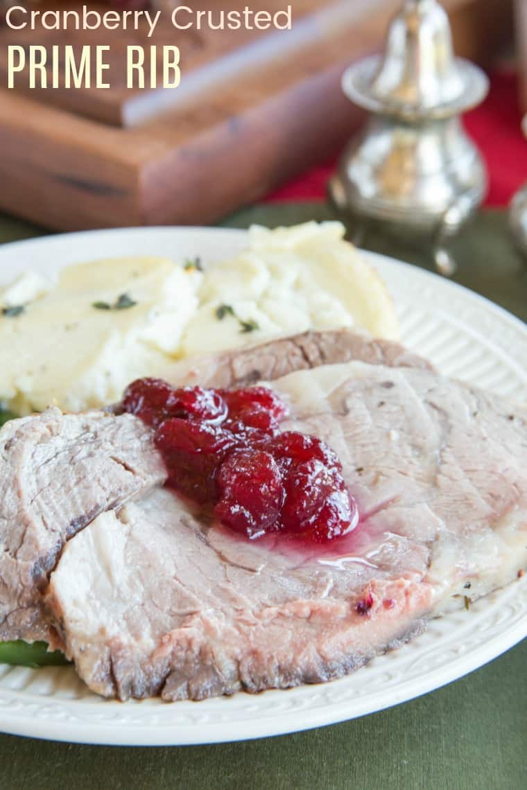 Cranberry Crusted Prime Rib Roast - a perfectly tender and flavorful beef roast coated with cranberries, garlic, and parsley is the ultimate recipe for a holiday meal or Sunday dinner. Enjoy it for Christmas or New Year's Eve. It is also, gluten free, low carb, and paleo. #primerib #beef #christmasdinner #glutenfree