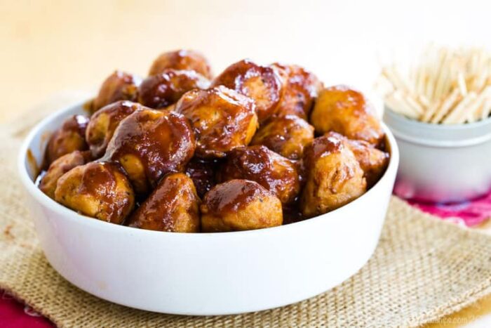 Bowl of Apple Cider Barbecue Turkey Meatballs with a container of toothpicks