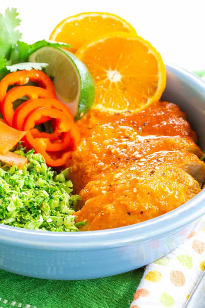 Closeup of Gluten Free Orange Chicken in a broccoli rice power bowl