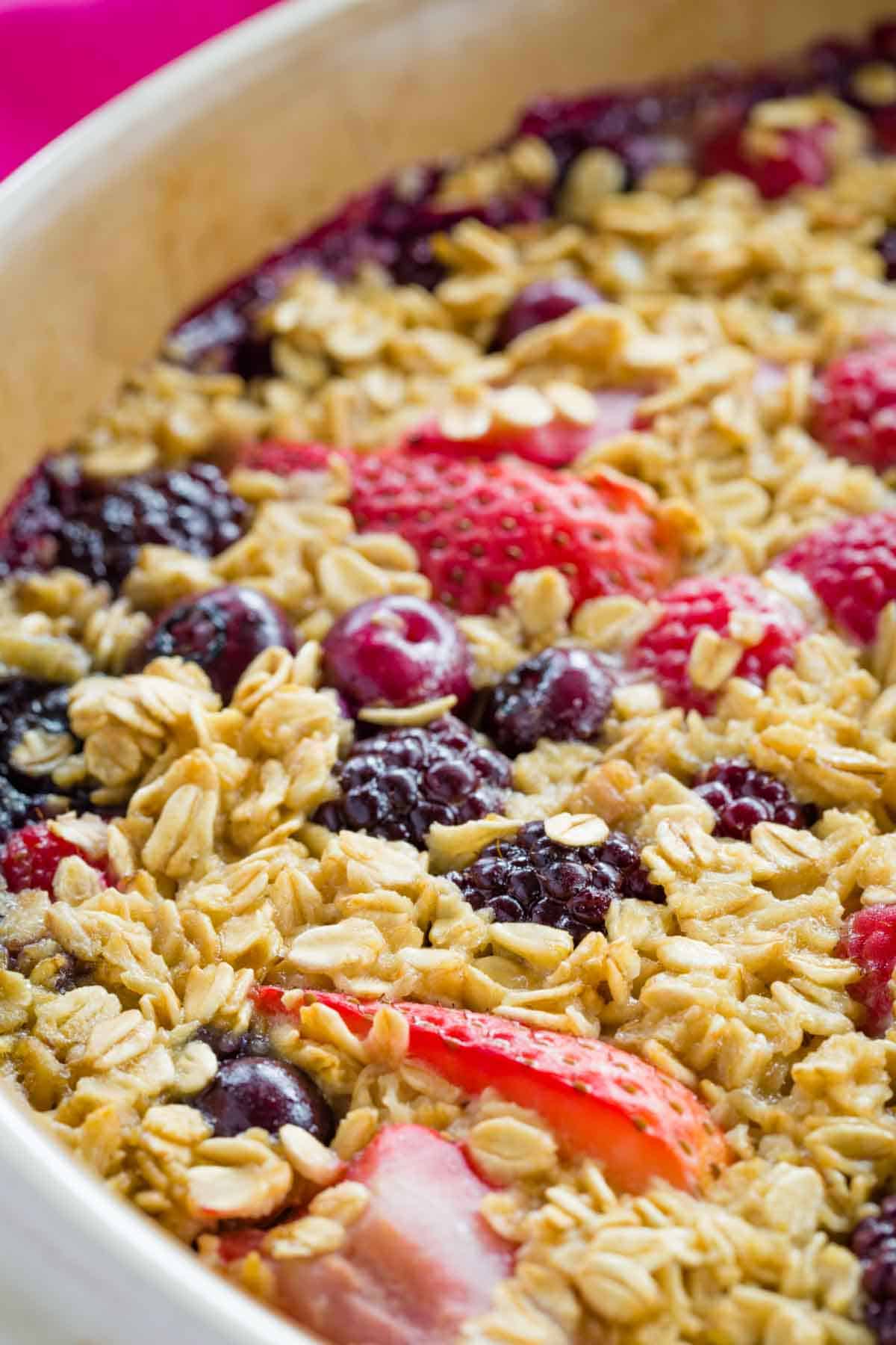 Closeup of Mixed Berry Baked Oatmeal with strawberries raspberries blackberries and blueberries