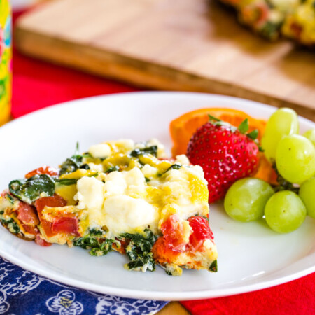 Tomato Feta Spinach Frittata served with fruit for brunch