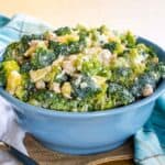 Tropical Pineapple Broccoli Salad in a blue serving bowl with a spoon