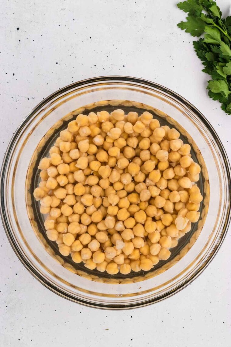 Chickpeas soaking in a bowl of water