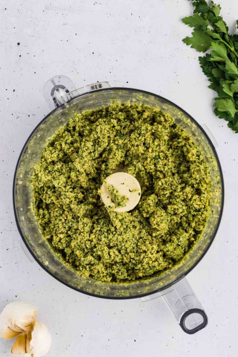 Crumbled falafel mixture in a food processor