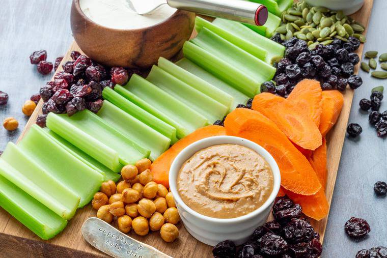 Ants on a Log ingredients on a kids snack board