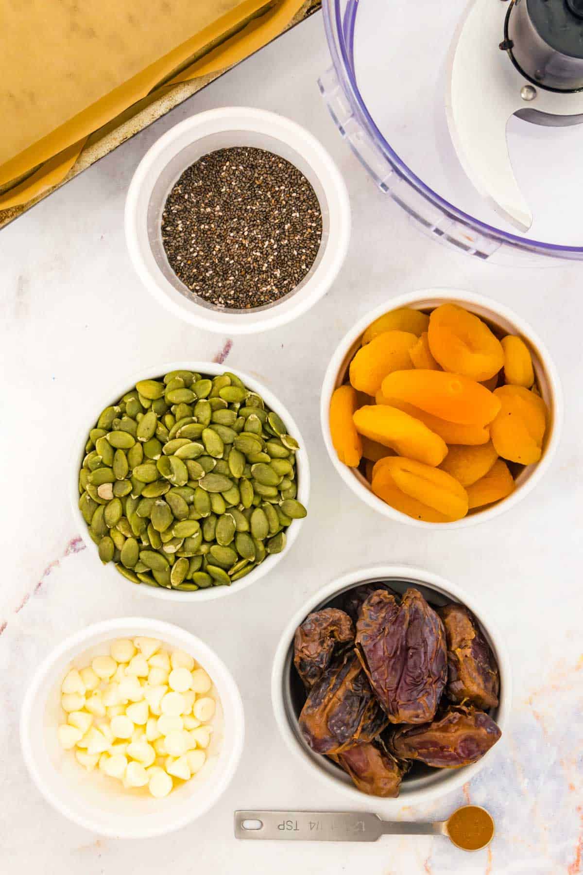 Bowls of ingredients to make energy bars.