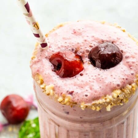 Cherry Cheesecake Smoothie with two cherries floating on top