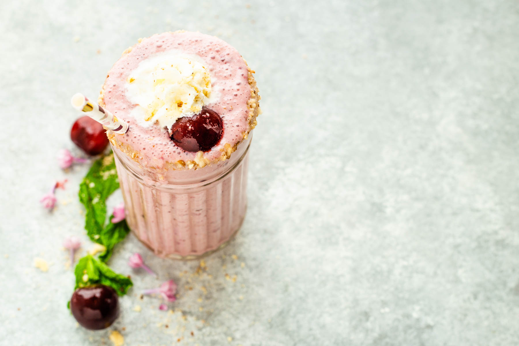 Overhead of Cheesecake Cherry Smoothie with whipped cream