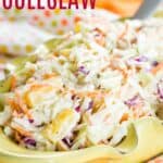 Coleslaw in a yellow serving dish with text overlay that says "Pineapple Coleslaw".