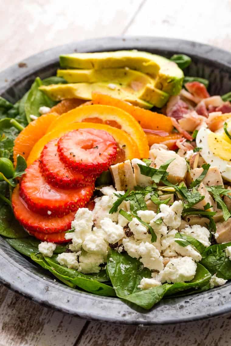 Closeup of Cobb-Style Strawberry Avocado Spinach Salad with Poppyseed Dressing