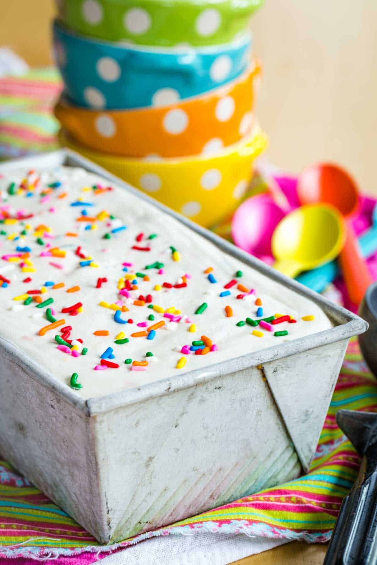 No-Churn Funfetti Birthday Cake Ice Cream with rainbow sprinkles in a loaf pan
