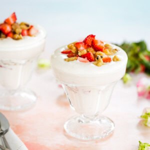 Two Low Carb Strawberry Cheesecake Parfaits in glasses.