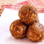 A small stack of easy pumpkin energy balls on a napkin
