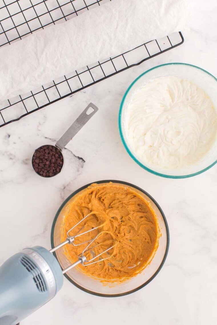 Mixing pumpkin with cream cheese and whipped cream